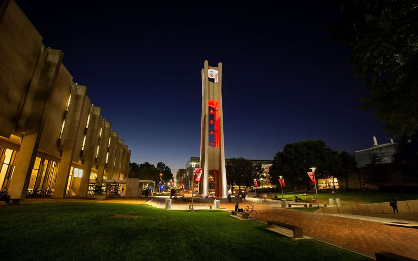 Temples iconic belltower lit red at night