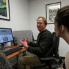 Linguistics professor with students in language lab