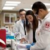 students in a pharmacy lab working on some tests. 