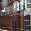 an abstract image of the outside of the fox school of business building on main campus as seen through a large window