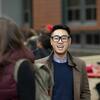 A Fox student talks with his peers outside of Alter Hall.